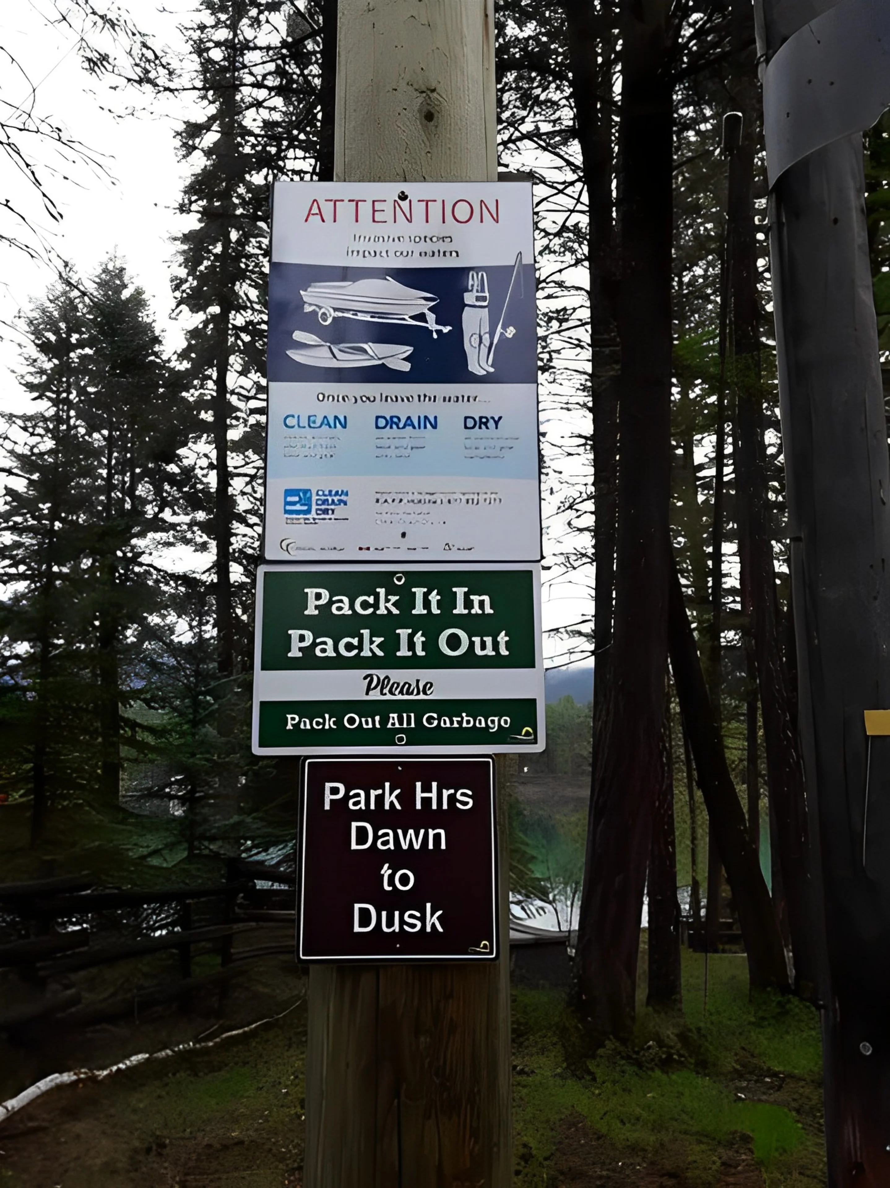 A bunch of signs on the side of a road